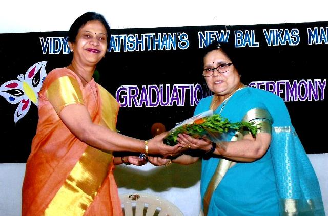 The Principal Mrs. K.A. Barawkar felicitating the Chief Guest Mrs. Madhavi Godbole.   